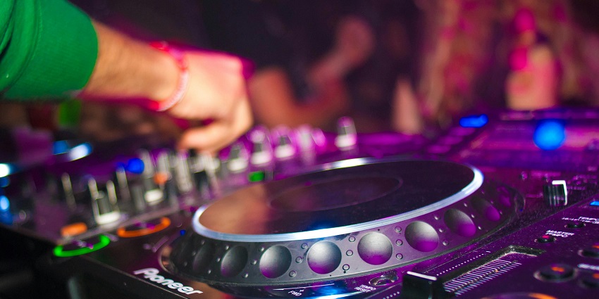 A girl on the dance floor at Barranquilla which offers a vibrant experience.