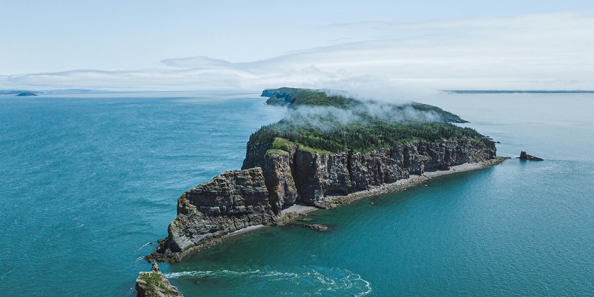 Image of a woman kayaking in Bay of Fundy, one of the best places for Kayaking in Canada.