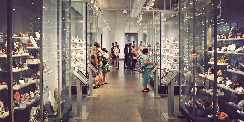 An image of mineral galleries at the Royal Ontario Museum, showcasing colourful mineral displays.