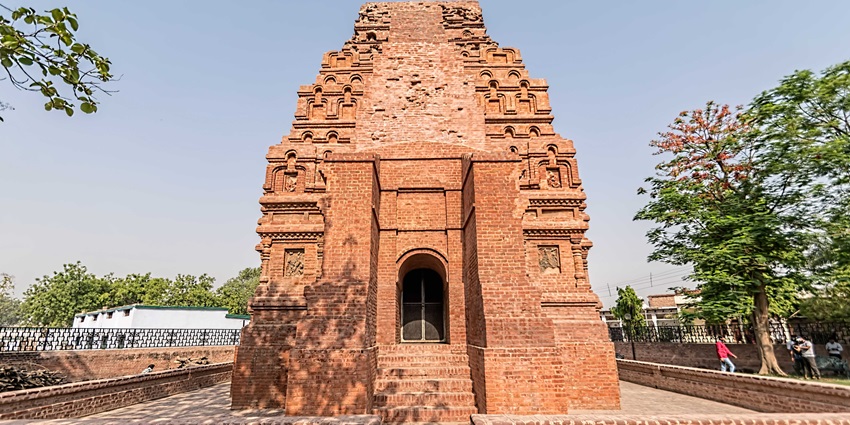 Ancient Gupta‑period Bhitargaon brick temple in Uttar Pradesh with stepped shikhara