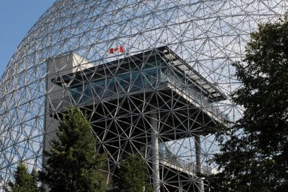 An image of the iconic geodesic dome of the Biosphere Museum, showcasing modern architecture