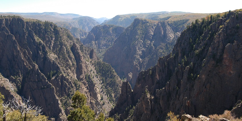 Stunning canyon with cliffs, rugged beauty, and adventure opportunities.