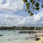 The picture of Blue Bay beach in Mauritius where people are enjoying their quality time.