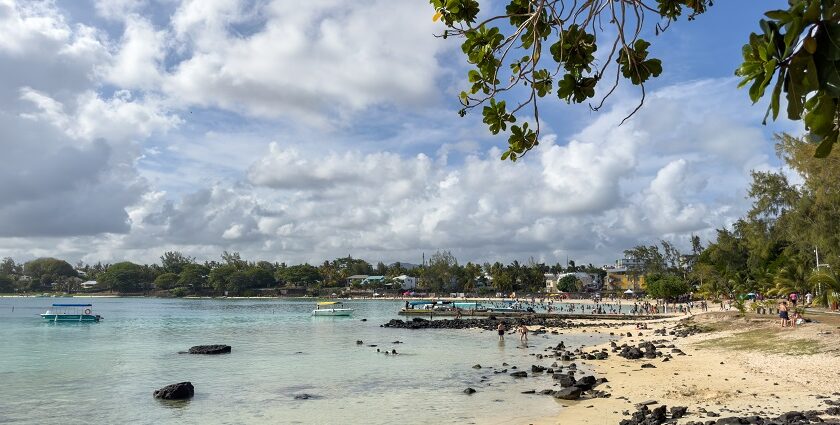 The picture of Blue Bay beach in Mauritius where people are enjoying their quality time.