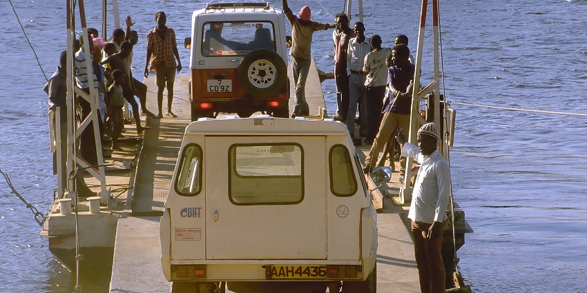 The beautiful picture of the people crossing the Kafue River located inside the Kafue National Park