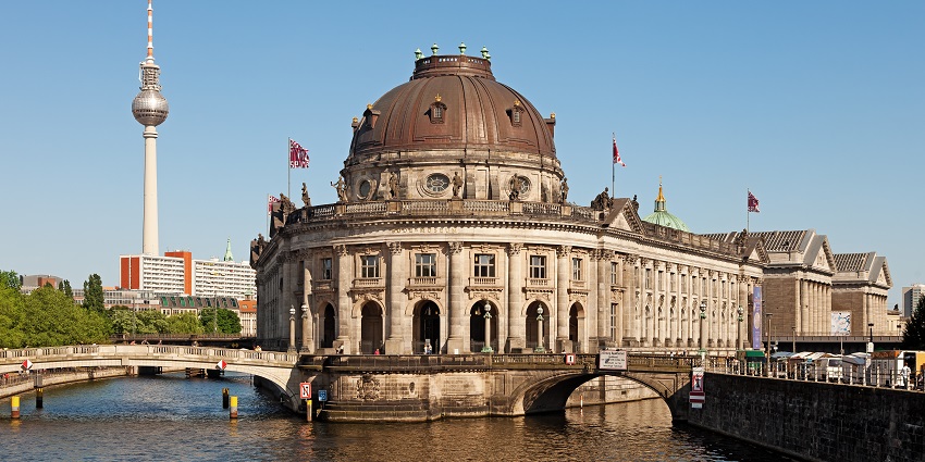 Intricately carved structure of Bode Museum above the water connecting to the bridge