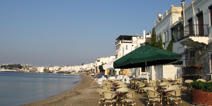 Picturesque town with beaches, castles, and luxury resorts.