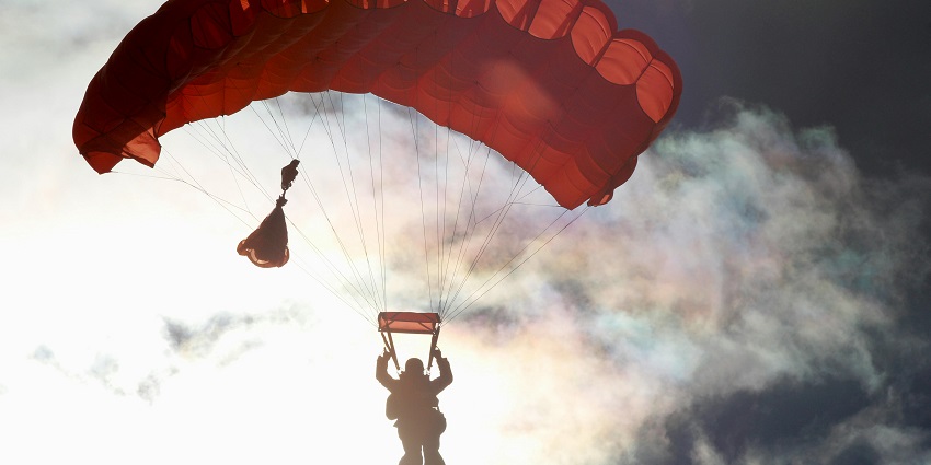 A photorealistic image of Jičín, a town in the Czech Republic, skydiving in Prague.