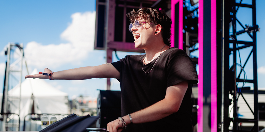 Vibrant EDM performance at Breakaway Music Festival in Ohio, with colorful lights and energy