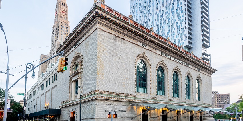 Exterior view of the Brooklyn Academy of Music (BAM) with modern architecture, near Brooklyn Museum.