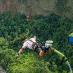 A man performing bungee jumping from a renowned bungee jumping spot in Odisha