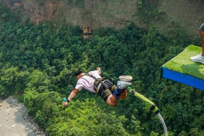 A man performing bungee jumping from a renowned bungee jumping spot in Odisha