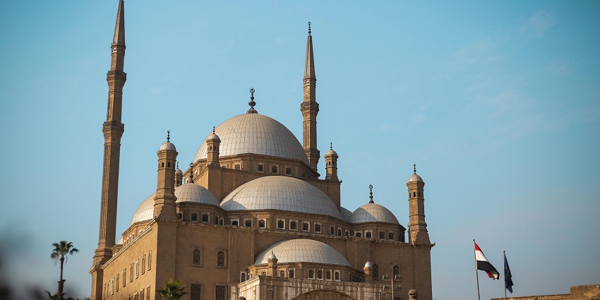 The complex top of the Cairo Citadel looks tranquil under a clear and bluish sky.