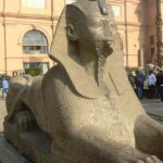 The statue in front of the entrance to the Museum of Antiquities in Cairo is located in Egypt.