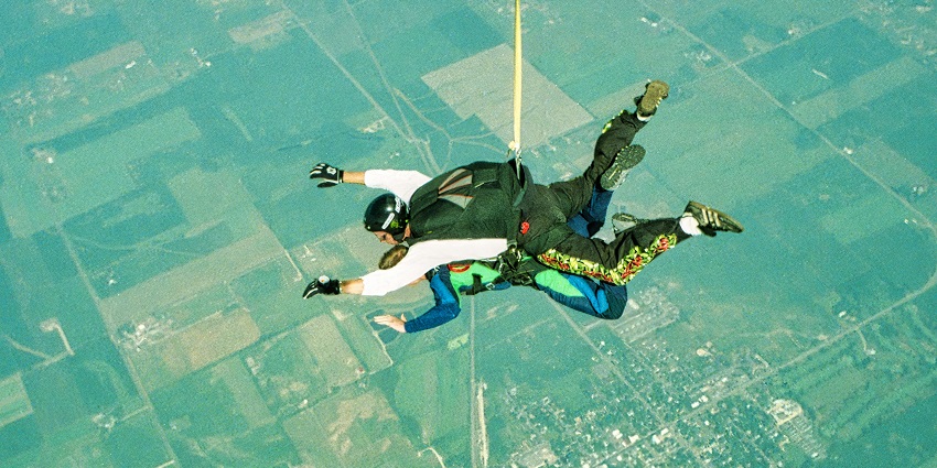 An image of a woman skydiving in Calgary, a famous place for skydiving in Canada.