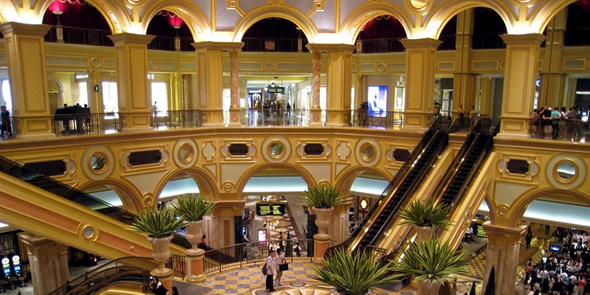 Grand interior view of The Venetian Macao with ornate ceiling and chandeliers