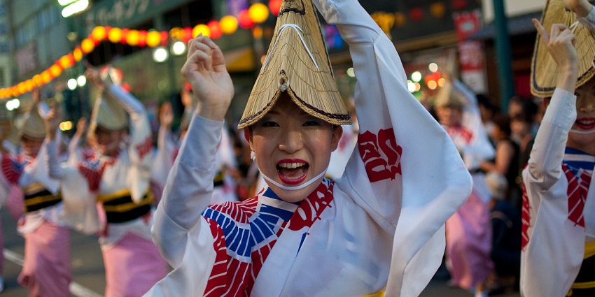 A group of Japanese dancing at the Awa Odori Dance Festival, a must-see cultural experience among top things to do in Japan