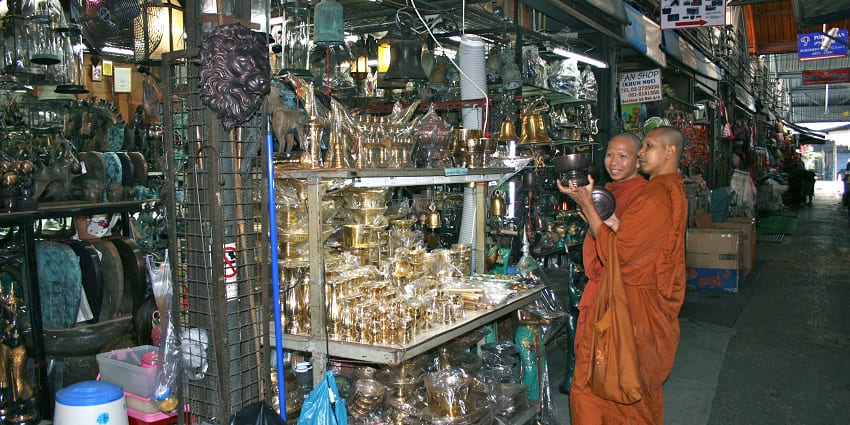 Vibrant market offering diverse goods and street food, featured in Bangkok travel guide