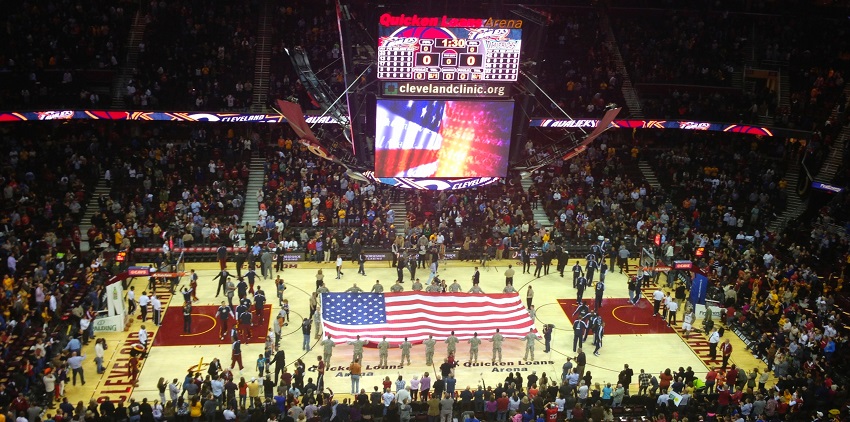 Quicken Loans basketball arena with people holding the U.S. flag and players getting ready
Viewers of this file can see comments and suggestions