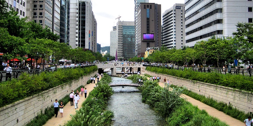 Urban stream with scenic pathways, bridges, and relaxing city ambience.
