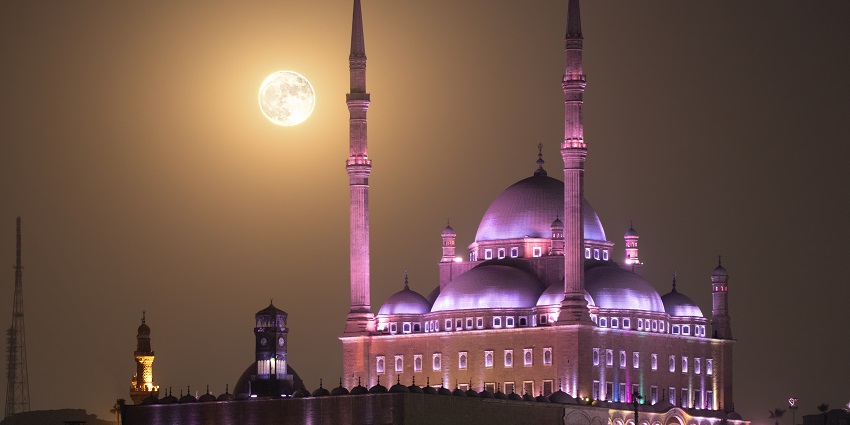 Nighttime view of the Citadel of Saladin featuring a full moon and mesmerising illumination.