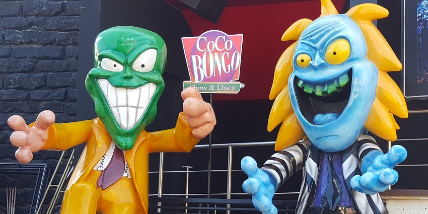 Performers dressed as The Mask and Beetlejuice on stage at Coco Bongo nightclub.