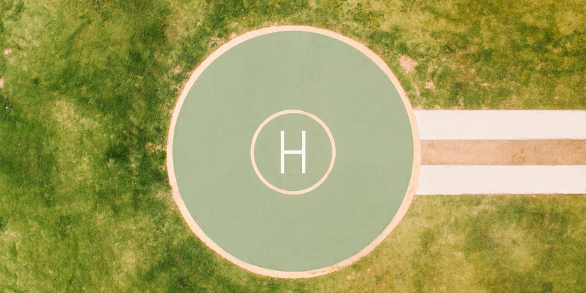 Helipad from above with H in the middle of the green circle - one of the airports in Malta.