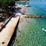 A picture of a clear turquoise sea and pebble beach, Island Krk.