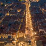 An aerial view of city buildings during the nighttime showcasing Croatia nightlife.