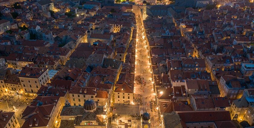 An aerial view of city buildings during the nighttime showcasing Croatia nightlife.