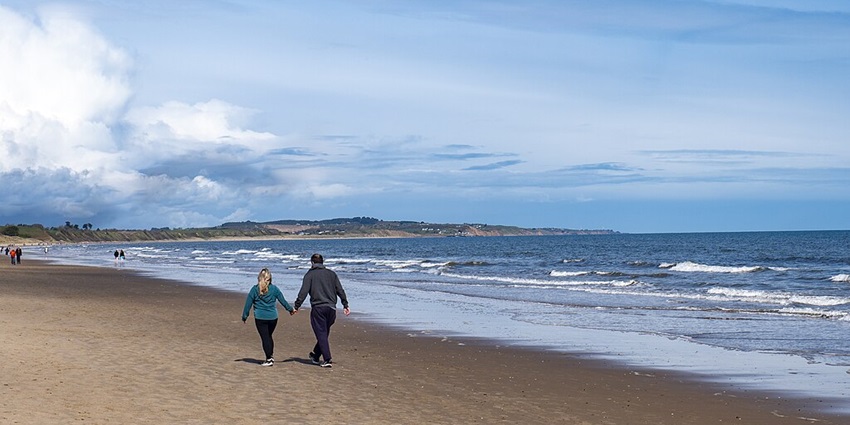 An image of Curracloe Beach, one of the top beaches in Ireland, with its calm waters