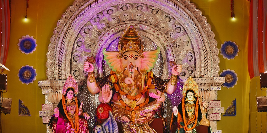 Image of idol lord Gganesha in a temple with decorative attire and design
