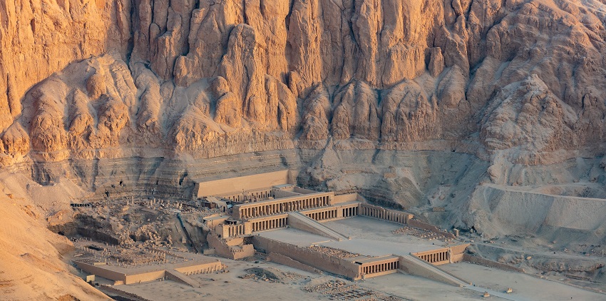 Hatshepsut temple from the top with ruined architecture and cliffs of Deir el-Bahari