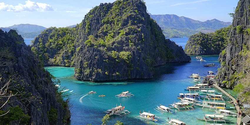 Explore the pristine beauty of Lake Taal’s clear waters, which is among the best things to do in Philippines