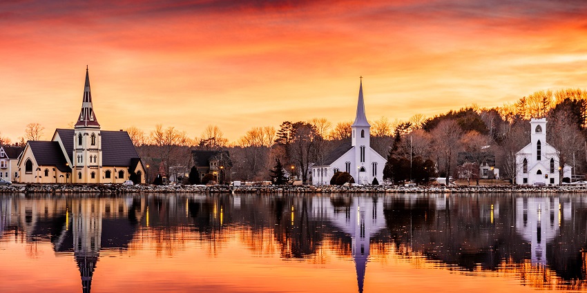 Explore serene churches at Mahone Bay - one of the things to do in Nova Scotia in October.