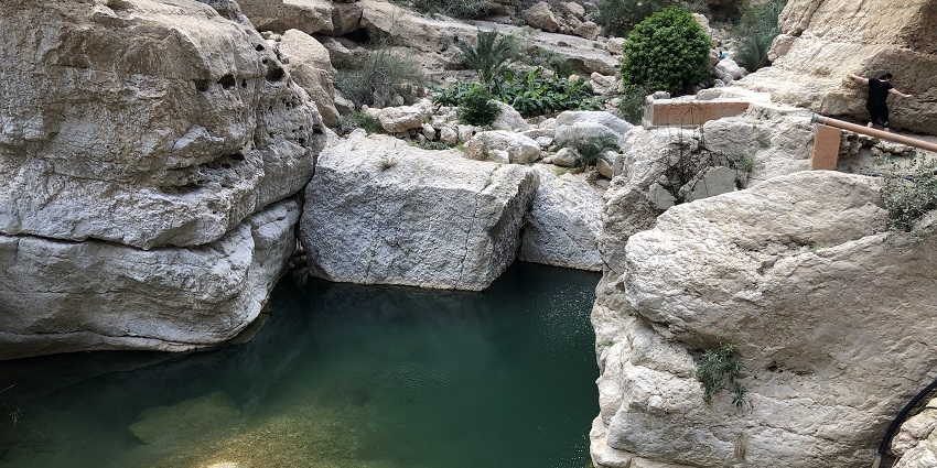 Image of scenic valley with hidden waterfalls and turquoise pools during day time