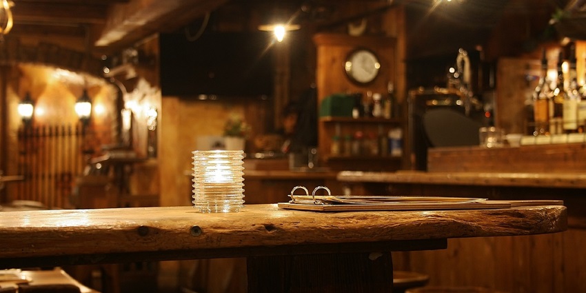 Cosy bar with warm lighting, comfortable seating, and a relaxed atmosphere