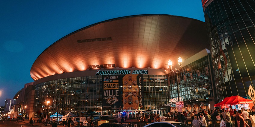 An image of Downtown Nashville, Tennessee - music at a DJ mixer at a lively event at a nightclub