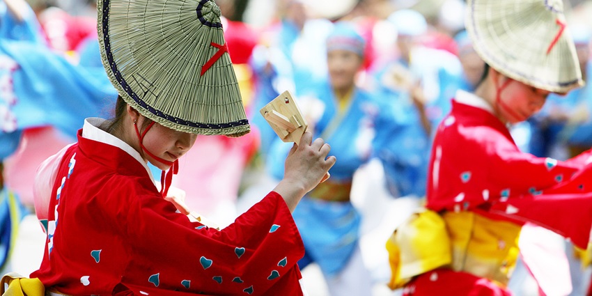 Energetic dancers in colorful costumes at the Yosakoi Soran Festival in Sapporo.