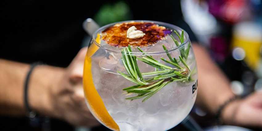 An image of a glass of drink with soda and ice on it also a lemon slice - czech republic nightlife