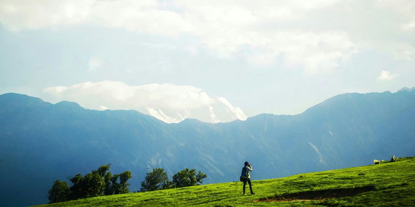 The Dzukou Valley Travel guide highlights the rolling meadows, lush flora, and mountain views
