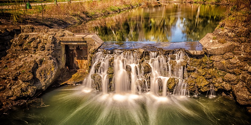 An image of a peaceful view of Edwards Gardens in Toronto, featuring lush greenery.