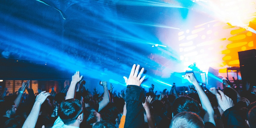Image of a lively crowd dancing inside a club, one of the best places for Ireland nightlife.