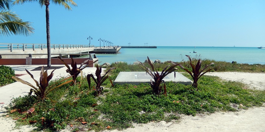 A beautiful sea view with palm trees from Higgs Beach, one of the best things to do in Key West Florida in October.