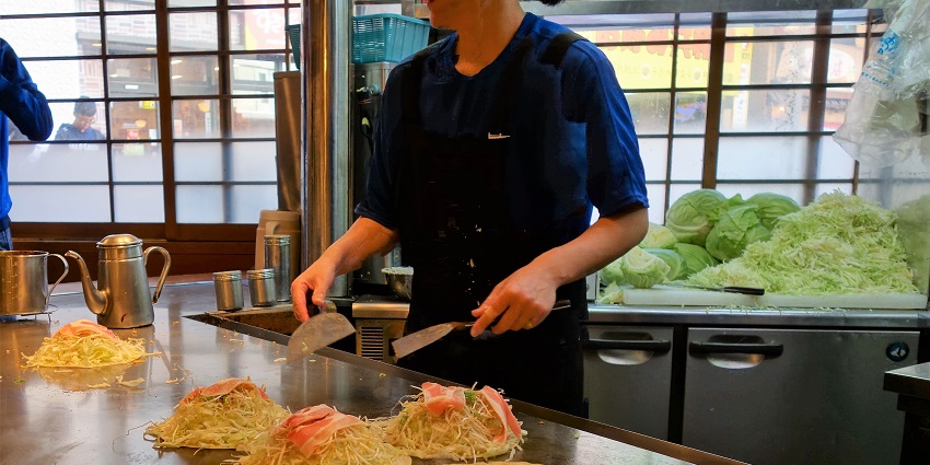 Taste Japan’s local cuisine, including okonomiyaki and fresh seafood in Hiroshima.