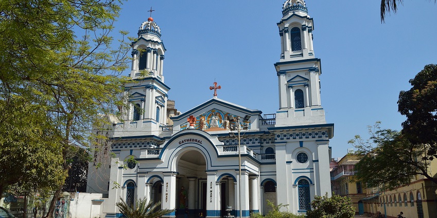 An image of All Saints Cathedral Stone Church surmounted by a cross in Allahabad.
