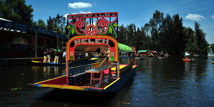 Popular Trajinera boats in one of the floating gardens of Xochimilco in Mexico City.