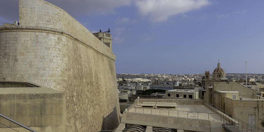Citadel, Victoria in Gozo Island showing a huge structure and small buildings in the distance.