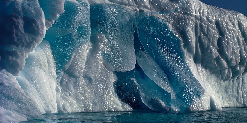 A breathtaking view of the Northeast Greenland National Park featuring majestic icebergs.