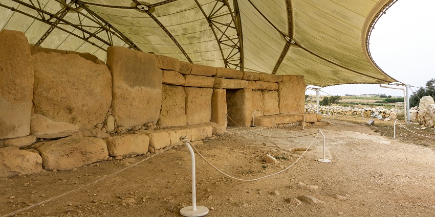 The ruins of the pre-historic Hagar Qim Temples are protected under a white canopy.